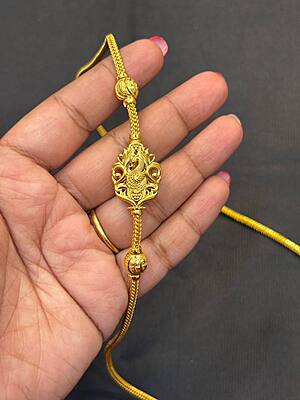 Silver lakshmi and mayil chain with gold finish