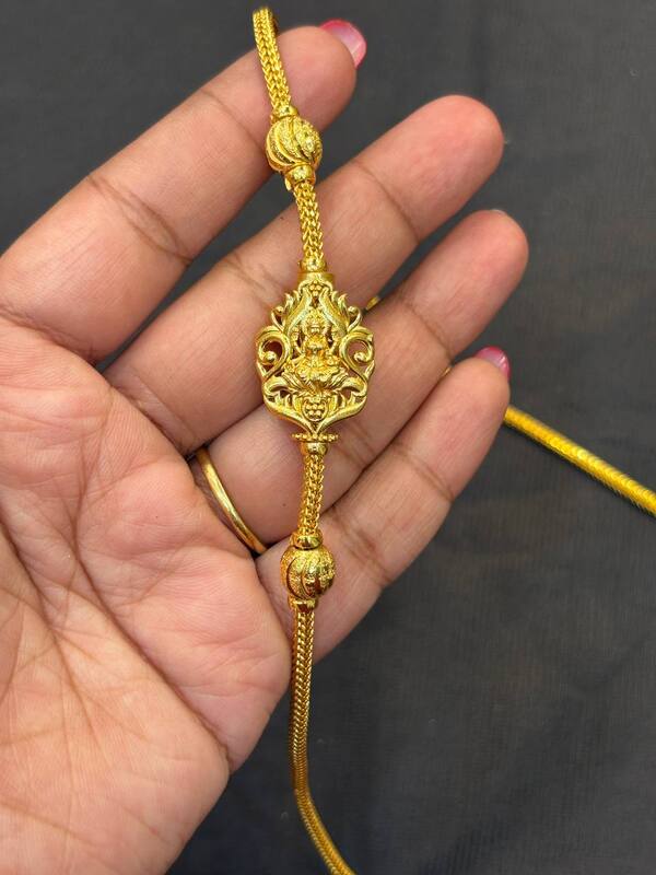 Silver lakshmi and mayil chain with gold finish