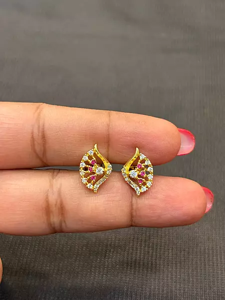Silver white with pink thilagam with gold finish