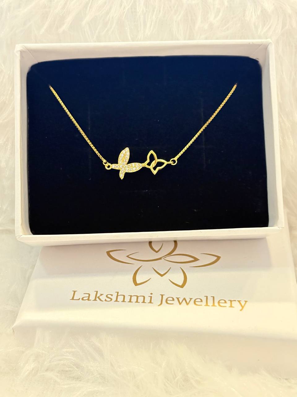 Silver double butterfly bracelet with gold finish