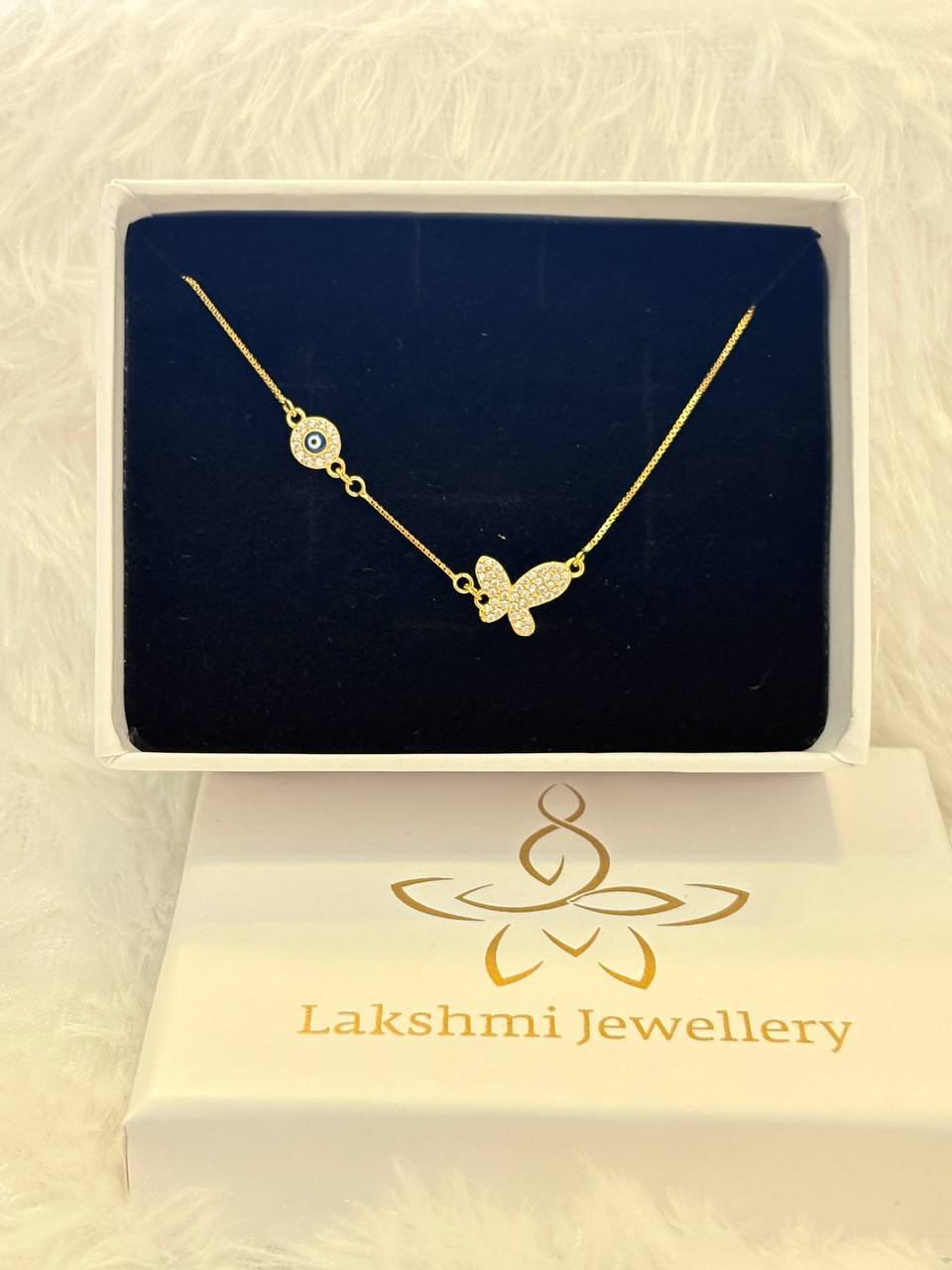 Silver butterfly with evil eye bracelet with gold finish