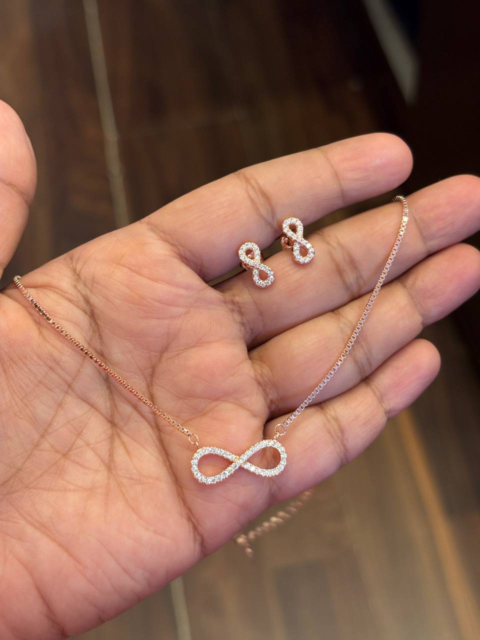 Silver infinity charm with rosegold finish