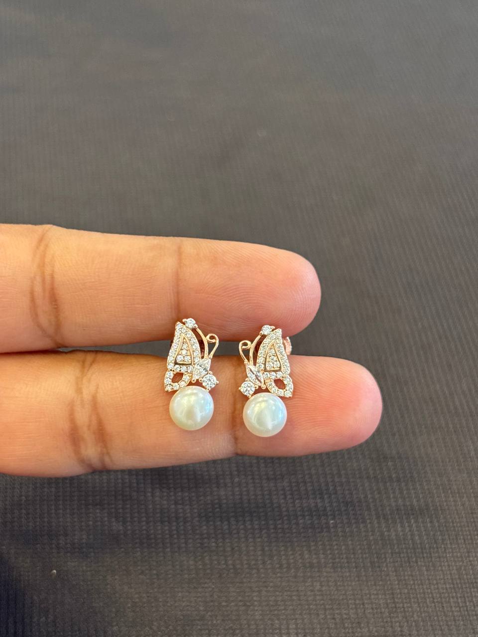Silver butterfly pearl stud with rosegold finish
