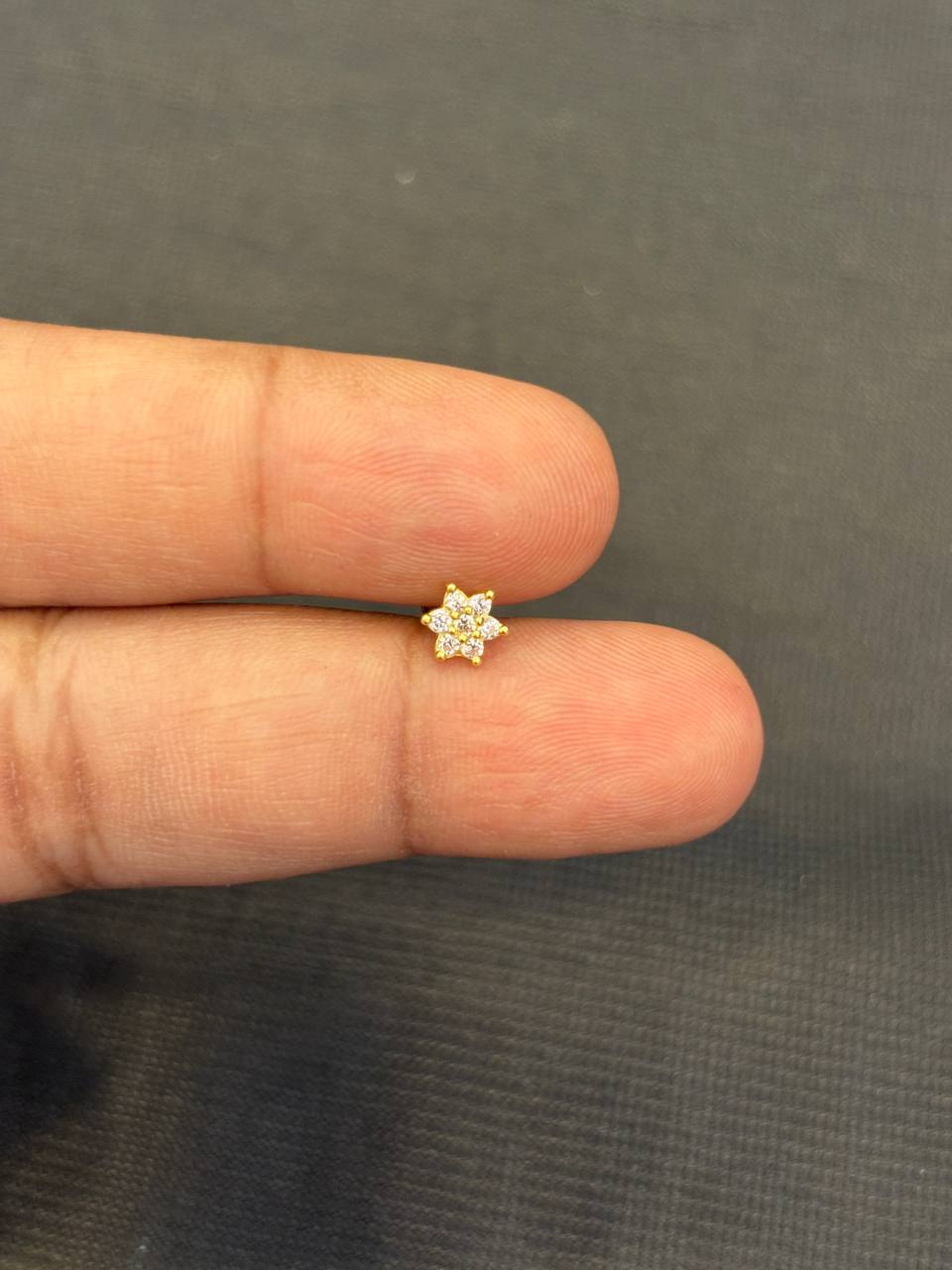 Silver white seven stone nosepin with gold finish