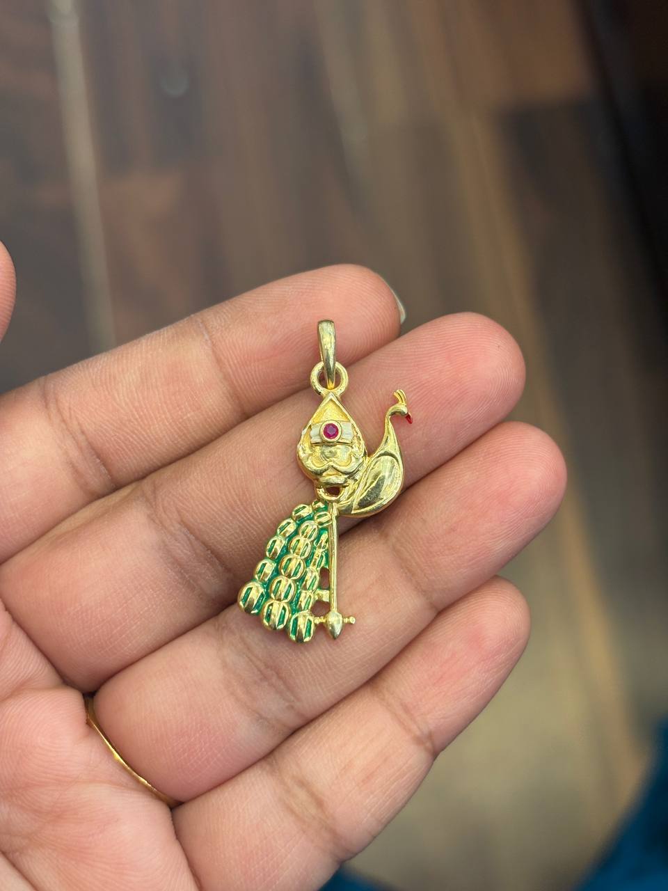Silver mayil pendant with gold finish