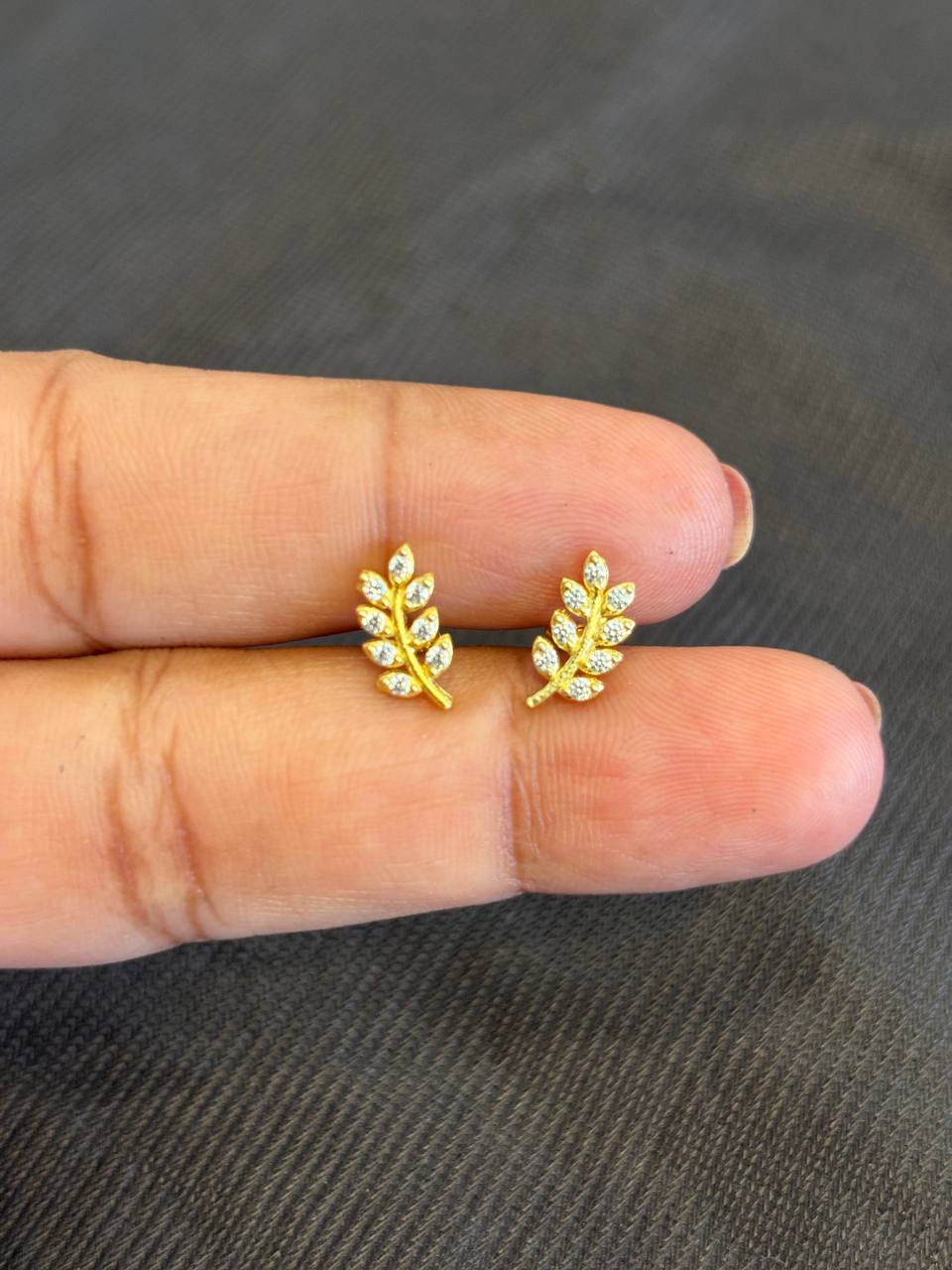 Silver ezhil leaf stud with gold finish