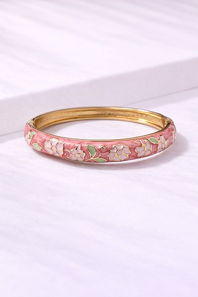 Pink enamel kada with blossoms