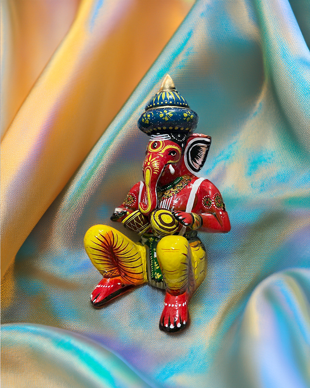 Playful Ganesha Wooden Statue