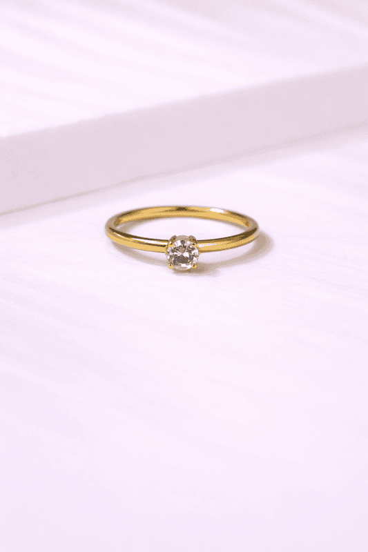 Solitaire diamond on gold band