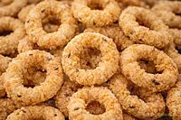 Worth2Deal Kerala Ring Murukku close-up showing crispy golden texture and sesame seeds