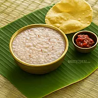 Worth2Deal Podiyari Kanji Rice served as Kerala-style kanji with pickle and papadam on a banana leaf