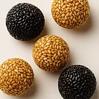 Detailed texture of Worth2Deal Til Laddu Ellurundai with crispy sesame and smooth sweet binding