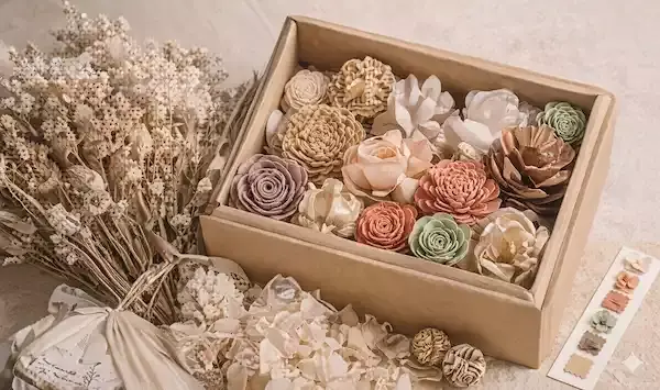 sample box with sola wood flowers and dried botanicals in natural tones for color selection and texture review sample box with sola wood flowers and dried botanicals in natural tones for color selection and texture review